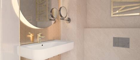 A modern bathroom with a white sink, a round mirror, and a toilet.