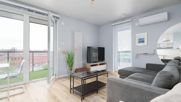 Apartamento, balcón, vistas a la ciudad | Sala de estar