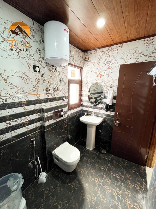 A bathroom with a toilet, sink, and shower. - Dogri Homes (Shimla)