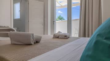 Family Quadruple Room, Ground Floor | Minibar, desk, laptop workspace, free WiFi