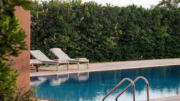Seasonal outdoor pool, pool loungers