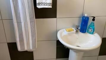 Shower, towels, soap, toilet paper