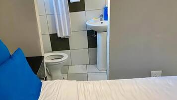 Shower, towels, soap, toilet paper