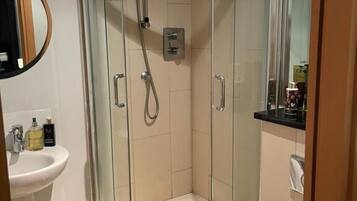 Shower, hair dryer, towels, soap
