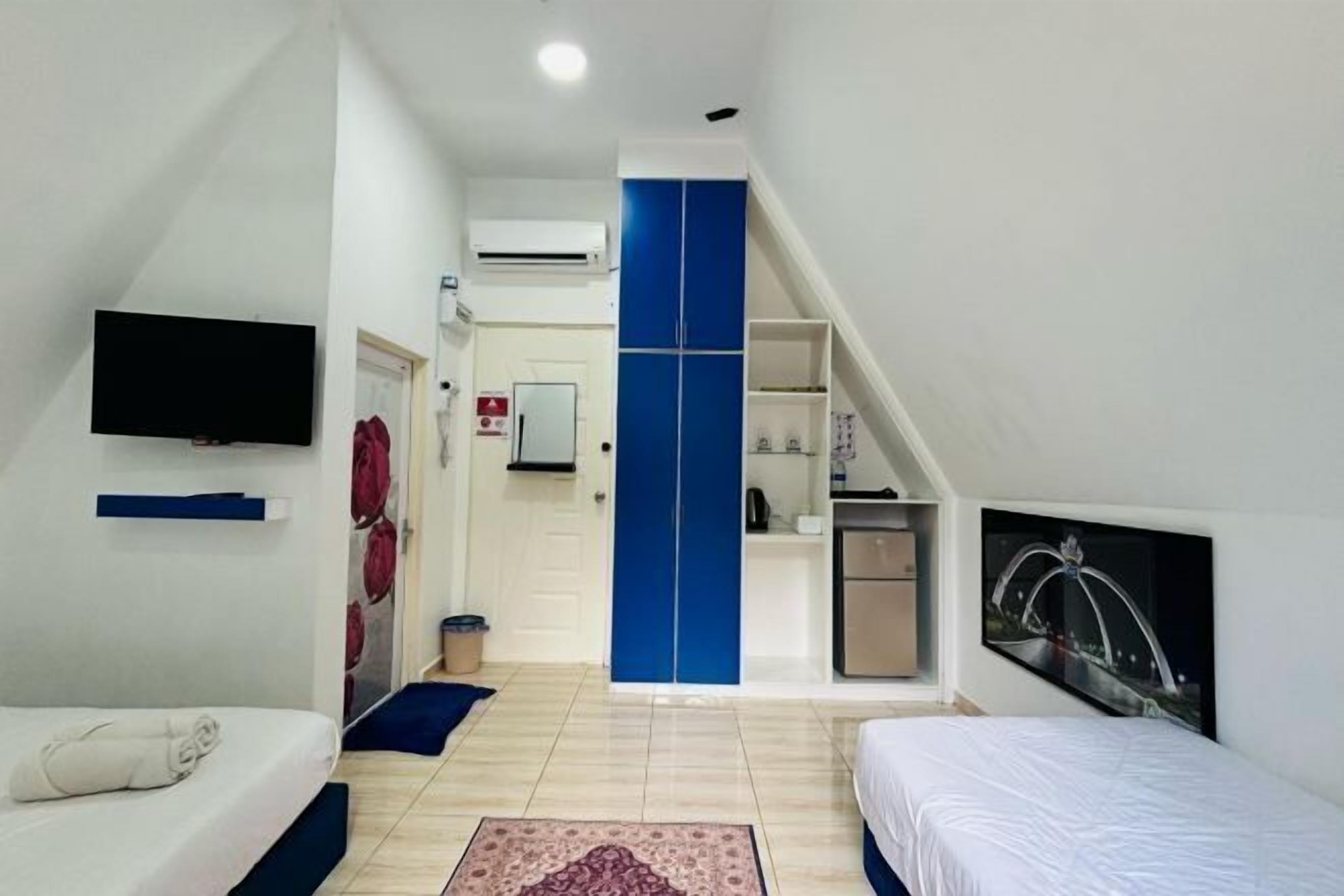 Desk, laptop workspace, bed sheets