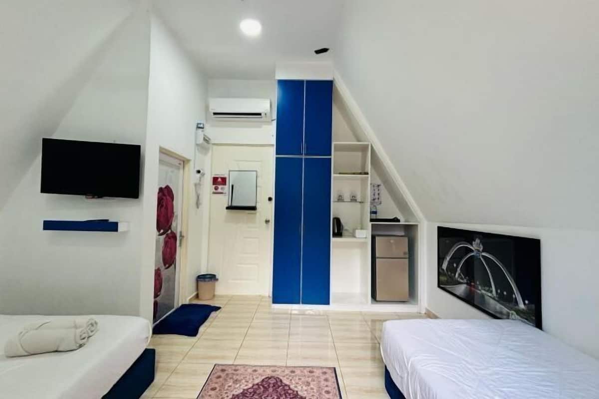 Desk, laptop workspace, bed sheets