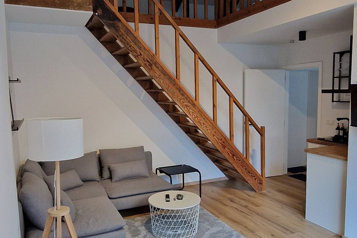Deluxe Duplex | Living area | 45-cm flat-screen TV with satellite channels