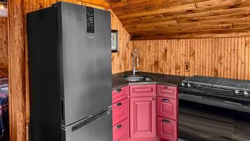 Fridge, coffee/tea maker, toaster, cookware/dishes/utensils