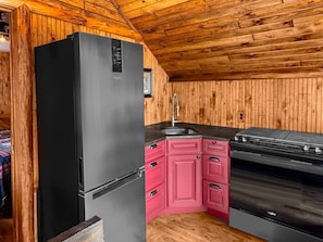Fridge, coffee/tea maker, toaster, cookware/dishes/utensils