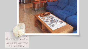 A compact living space with a kitchenette, a blue sofa, and a small dining table. - Apartment with 2 double bedrooms (4 persons), 1 bathroom at 400 meters from the beach (Boiro)