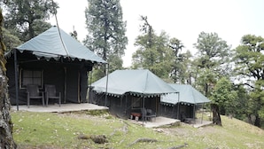 A campsite with two tents, each with a porch and seating area. - The Little Pahadi (Ukhimath)