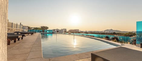 Seasonal outdoor pool, pool umbrellas, pool loungers