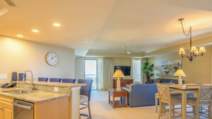 A hotel room with a kitchen, dining area, and living room. - Ocean Front, 1602 Royale Palms, full resort access!! (Myrtle Beach)