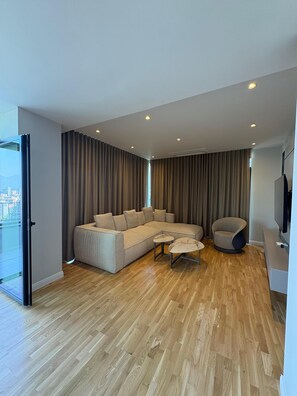 Three-Bedroom Deluxe Apartment | Living area | 32-inch flat-screen TV with cable channels - Blue Boutique Apartments 4 (Tirana)