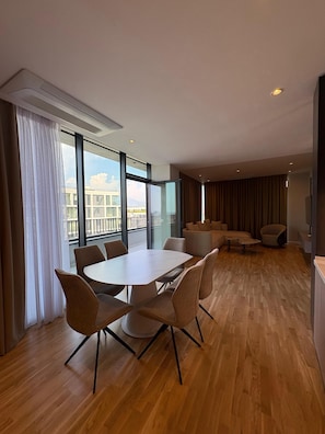 Three-Bedroom Deluxe Apartment | Living area | 32-inch flat-screen TV with cable channels