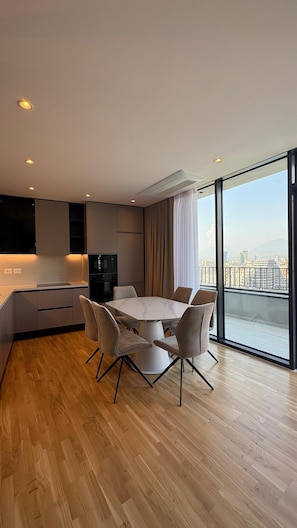 Three-Bedroom Deluxe Apartment | Private kitchen | Oven, stovetop