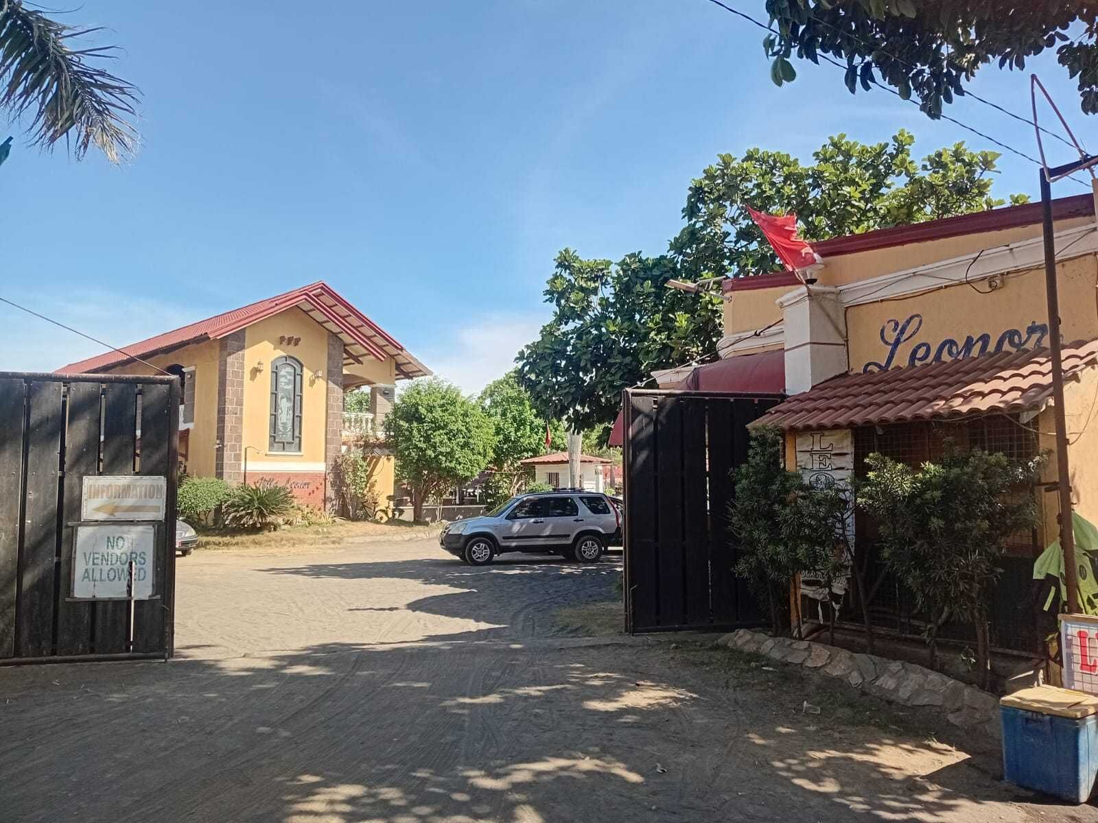A gated entrance to a property with a sign indicating no vendors allowed.