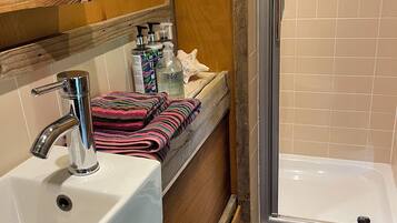 Eco-friendly toiletries, hair dryer, towels, soap
