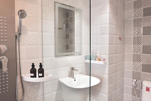 Shower, hair dryer, towels, soap