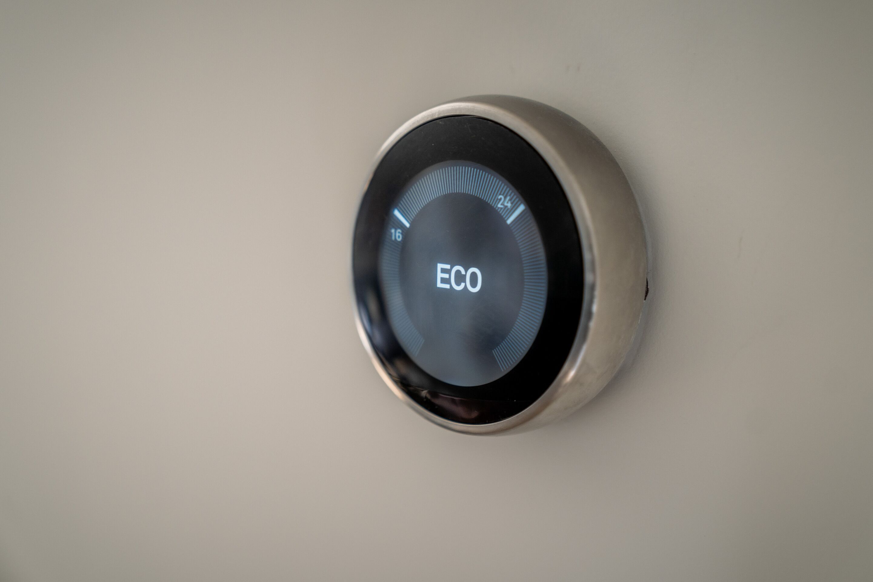 A circular device with a digital display and the word "ECO" on it.