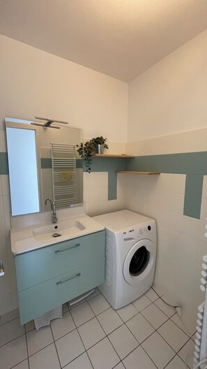 Shower, hair dryer, towels, toilet paper
