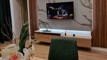 Apartment | Living area | 40-inch Smart TV with cable channels