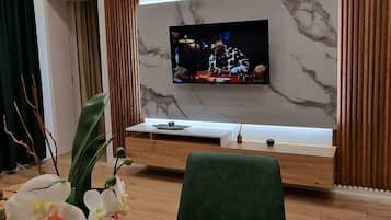 Apartment | Living area | 40-inch Smart TV with cable channels