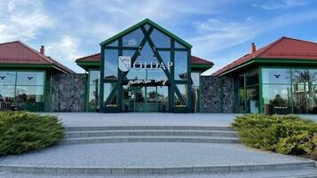 A building with a green roof and a sign that reads "OldAP".
