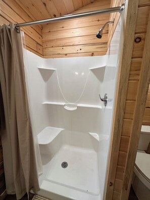 Shower, hair dryer, towels, toilet paper