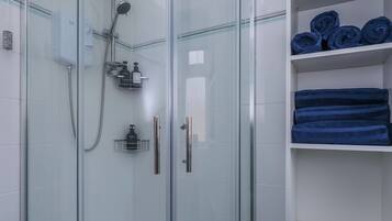 Shower, hair dryer, towels, soap