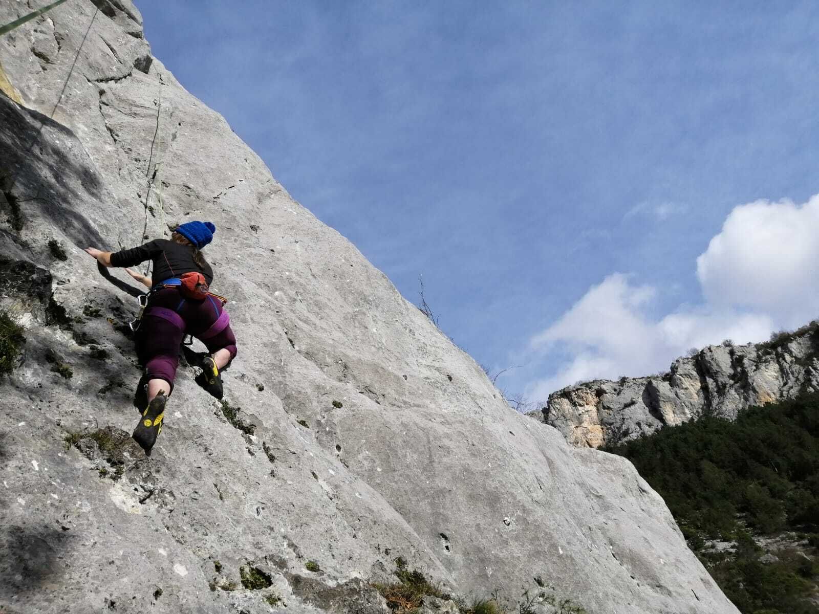 A person climbing a rocky mountain.