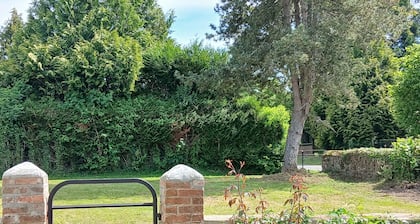 Lovely detached house close to village on enclosed land planted with trees.