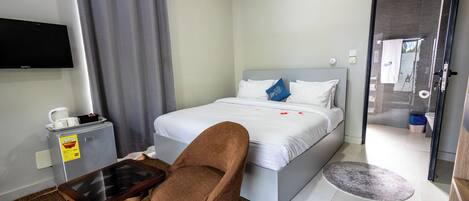 Family Room, Garden View | Laptop workspace, blackout drapes, iron/ironing board, WiFi (free)
