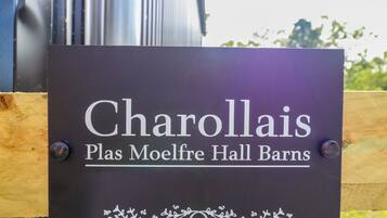 A sign for Charollais Plas Moelfre Hall Barns.