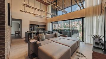 Luxury Duplex, City View | Living area | 50-inch Smart TV with digital channels