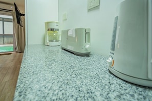 A kitchen counter with a coffee maker and a toaster. - Spacious Apartment in Downtown Buenos Aires (Buenos Aires)