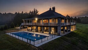 A large house with a swimming pool, multiple balconies, and a covered outdoor area. - Lakefront - Private Resort with INGROUND POOL! (Dandridge)