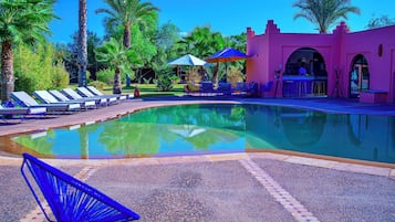 Outdoor pool, open 7:00 AM to 10:00 PM, pool loungers