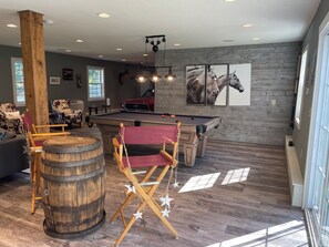 Games room - Charming 5-bedroom cottage with WiFi, AC, recreation barn and great beach. (Fremont)