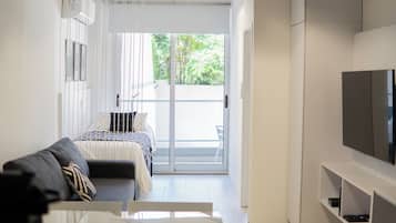 Departamento, 1 habitación, balcón, vista a la ciudad | Área de sala de estar | Smart TV, Netflix, servicios de streaming y oficina
