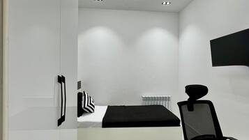 Blackout drapes, iron/ironing board, free WiFi, bed sheets