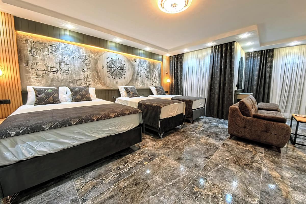 Family Quadruple Room, Balcony, Mountain View | In-room safe, desk, laptop workspace, blackout curtains