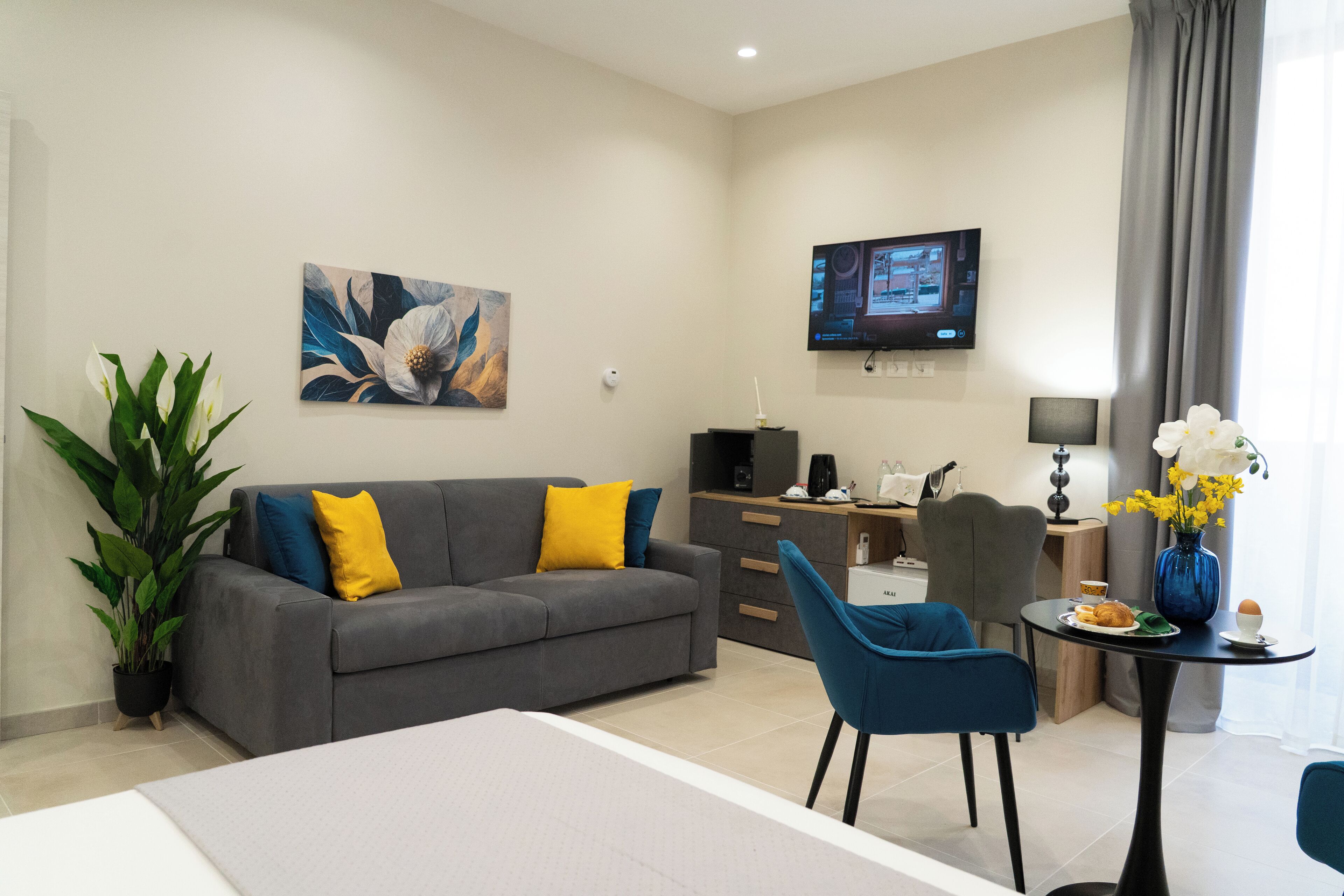 Deluxe Triple Room, Balcony, City View | In-room safe, desk, laptop workspace, blackout curtains