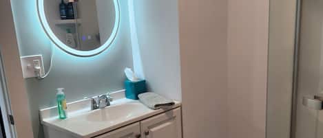 Shower, hair dryer, towels, soap