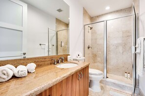 A modern bathroom with a marble countertop, a sink, a toilet, and a glass-enclosed shower. - 4-Bed + Den with pool in Las Olas, Ft Lauderdale (Fort Lauderdale)