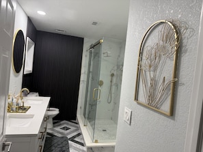 Shower, hair dryer, towels, soap