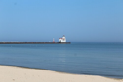 The Nauti Pelican! Steps from Lake Michigan's stunning beach- Your Dream Escape!