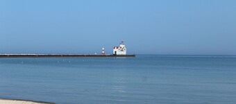 The Nauti Pelican! Steps from Lake Michigan's stunning beach- Your Dream Escape!
