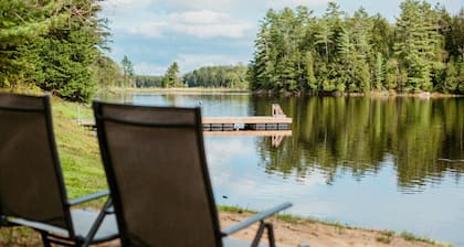 Modern 4BR Lakefront Escape w/King Beds & Hot Tub