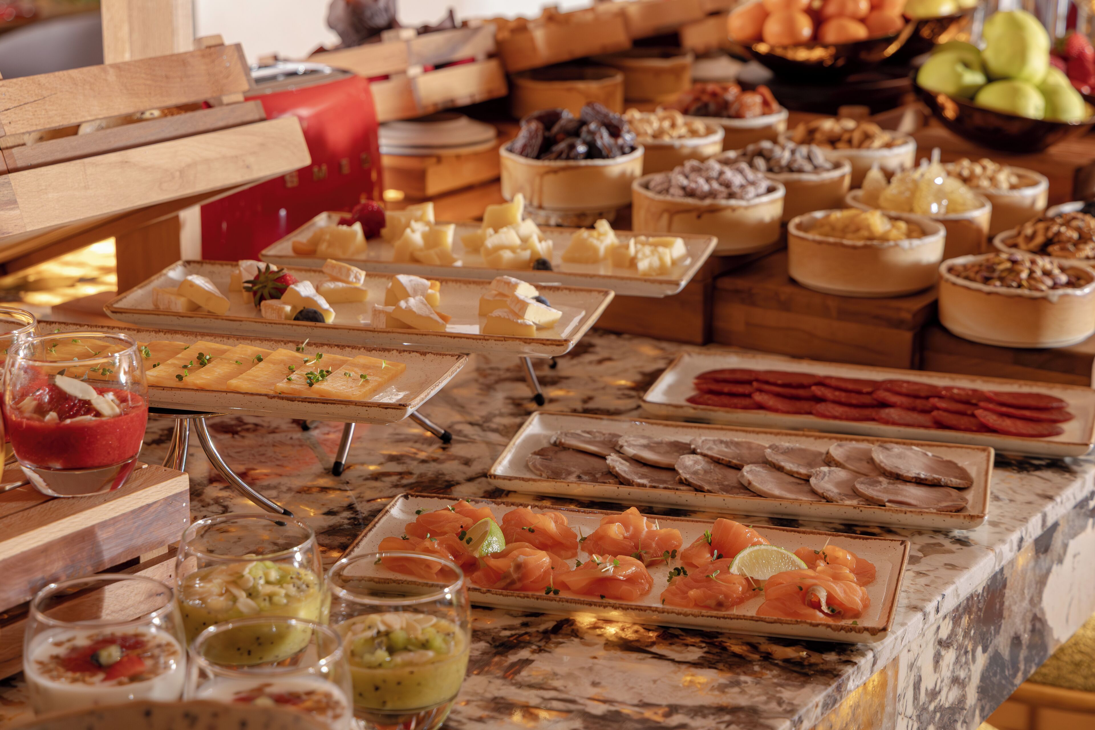 A buffet with various food items and beverages.